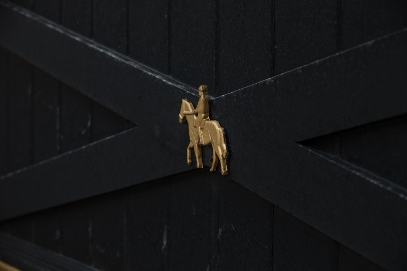 Custom horse and rider metal cutouts for a driveway gate