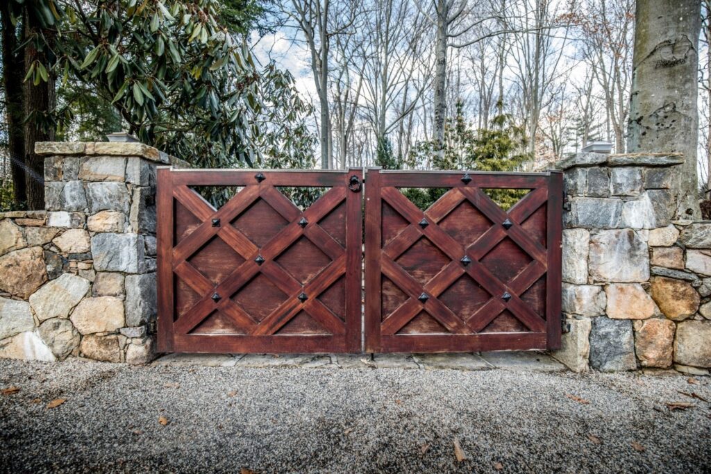 Vintage Wooden Driveway Gate with Stone Pillars