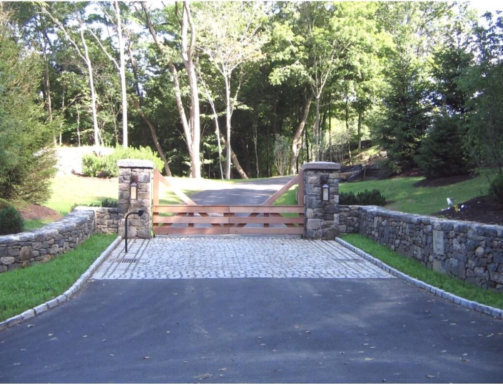 Cedar Wood Ranch Style Driveway Gate with Stone Pillars