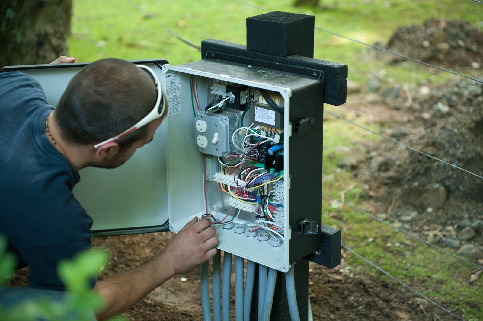 Technician works on call box