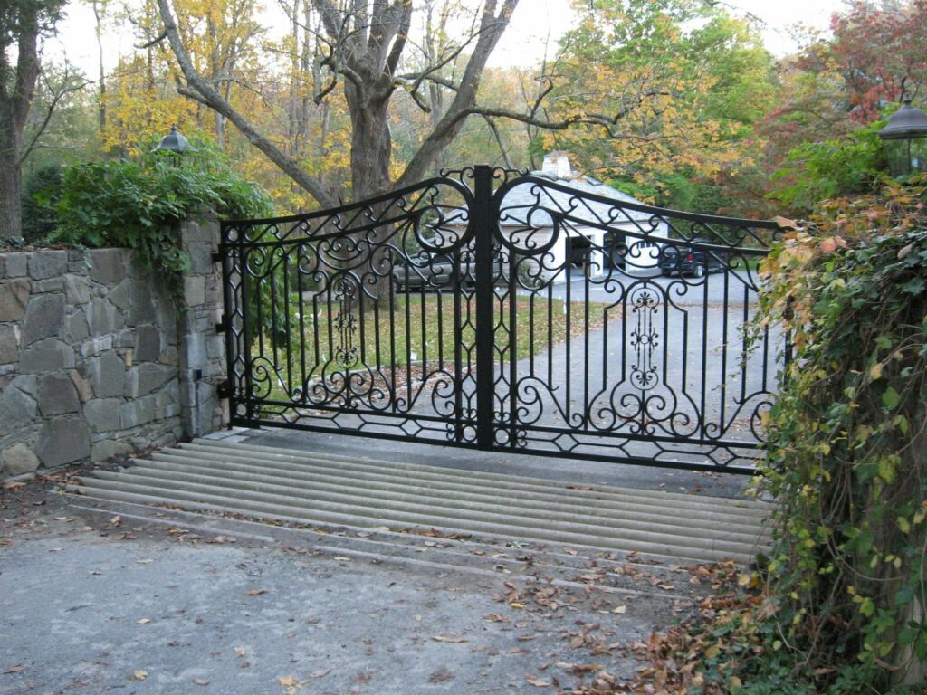 Metal Driveway Gate with Stone Fencing