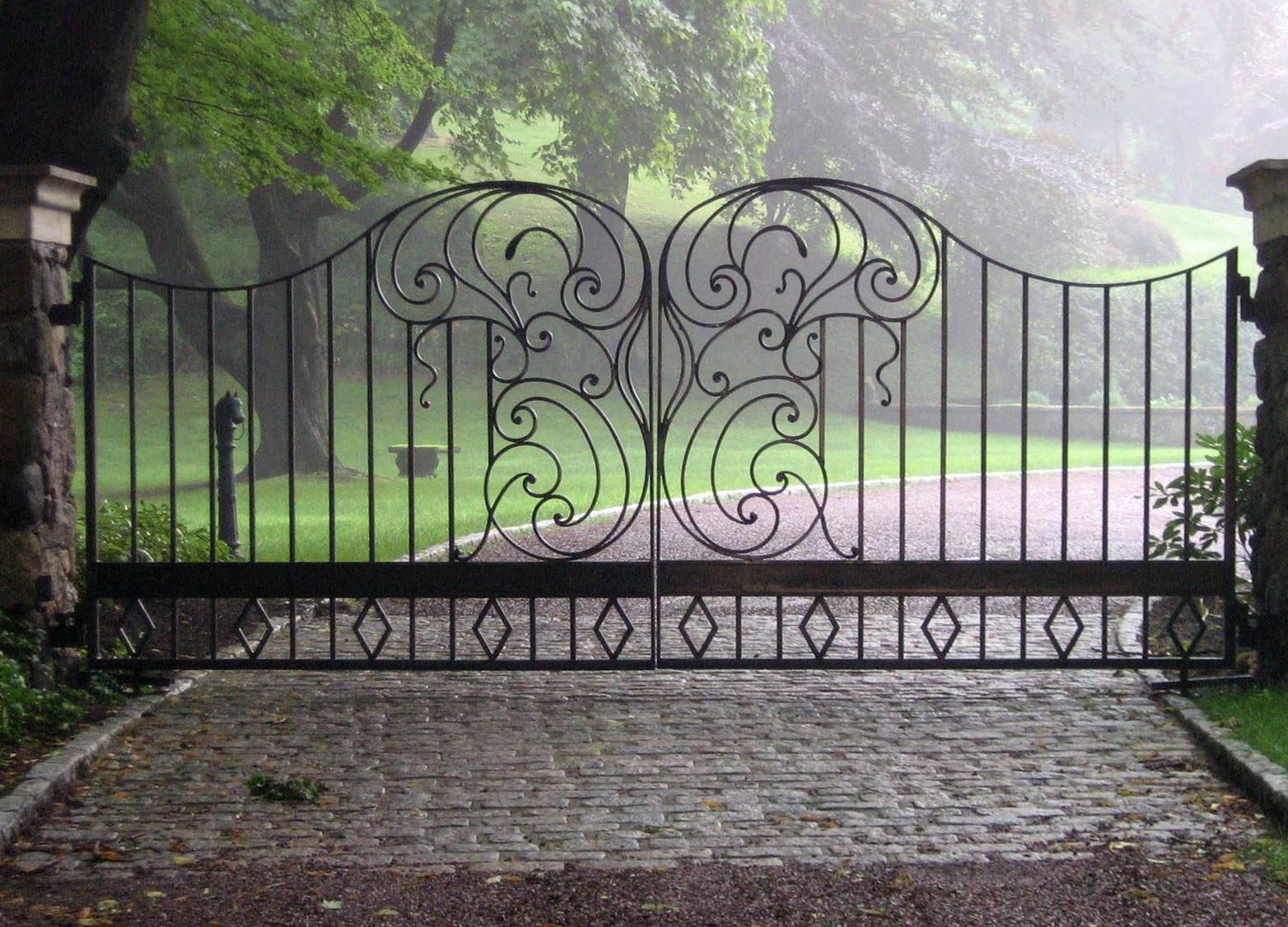 iron driveway gate with unique central pattern