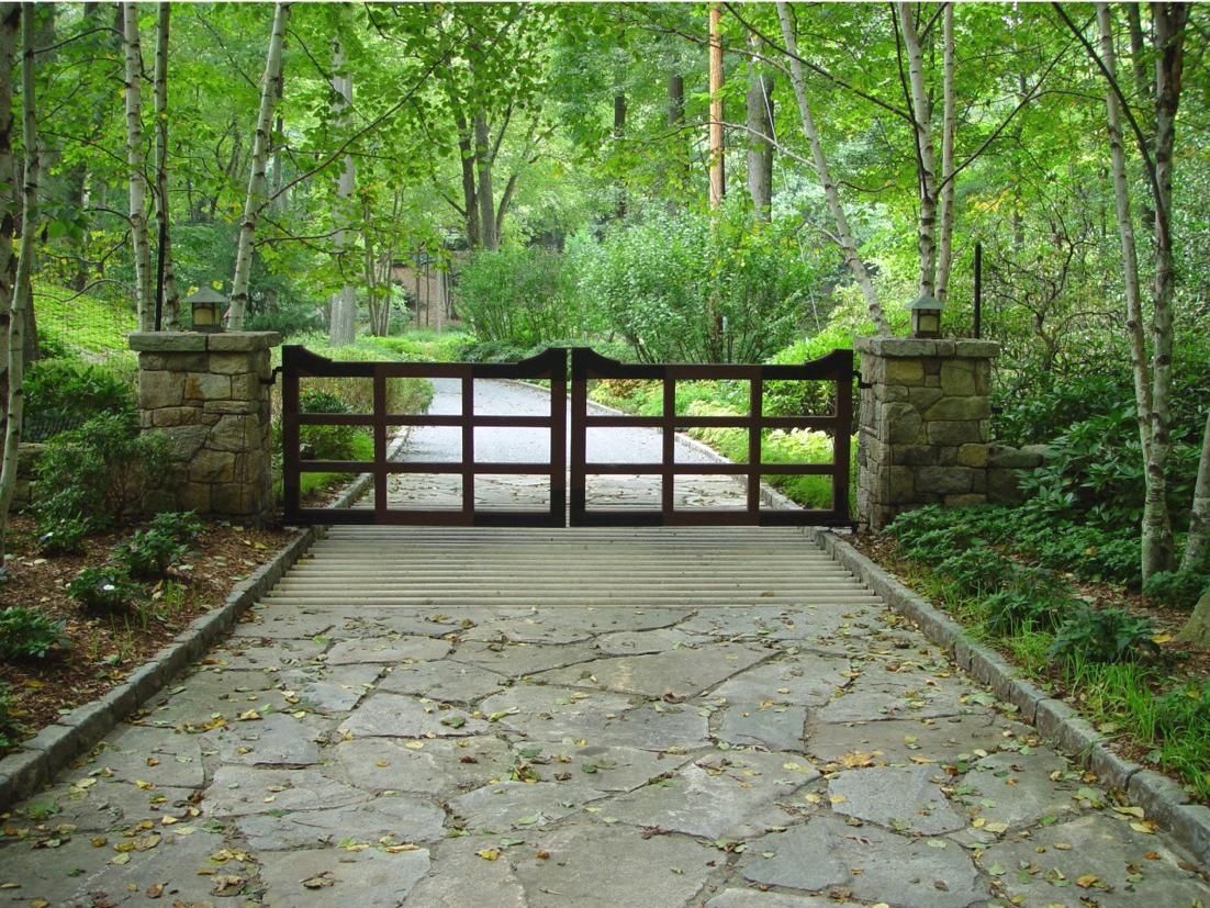 metal gate in rectangular patten with stone pillars