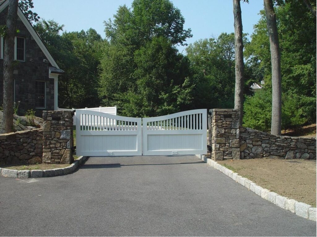 White Wooden Swing Driveway Gate with Stone Posts