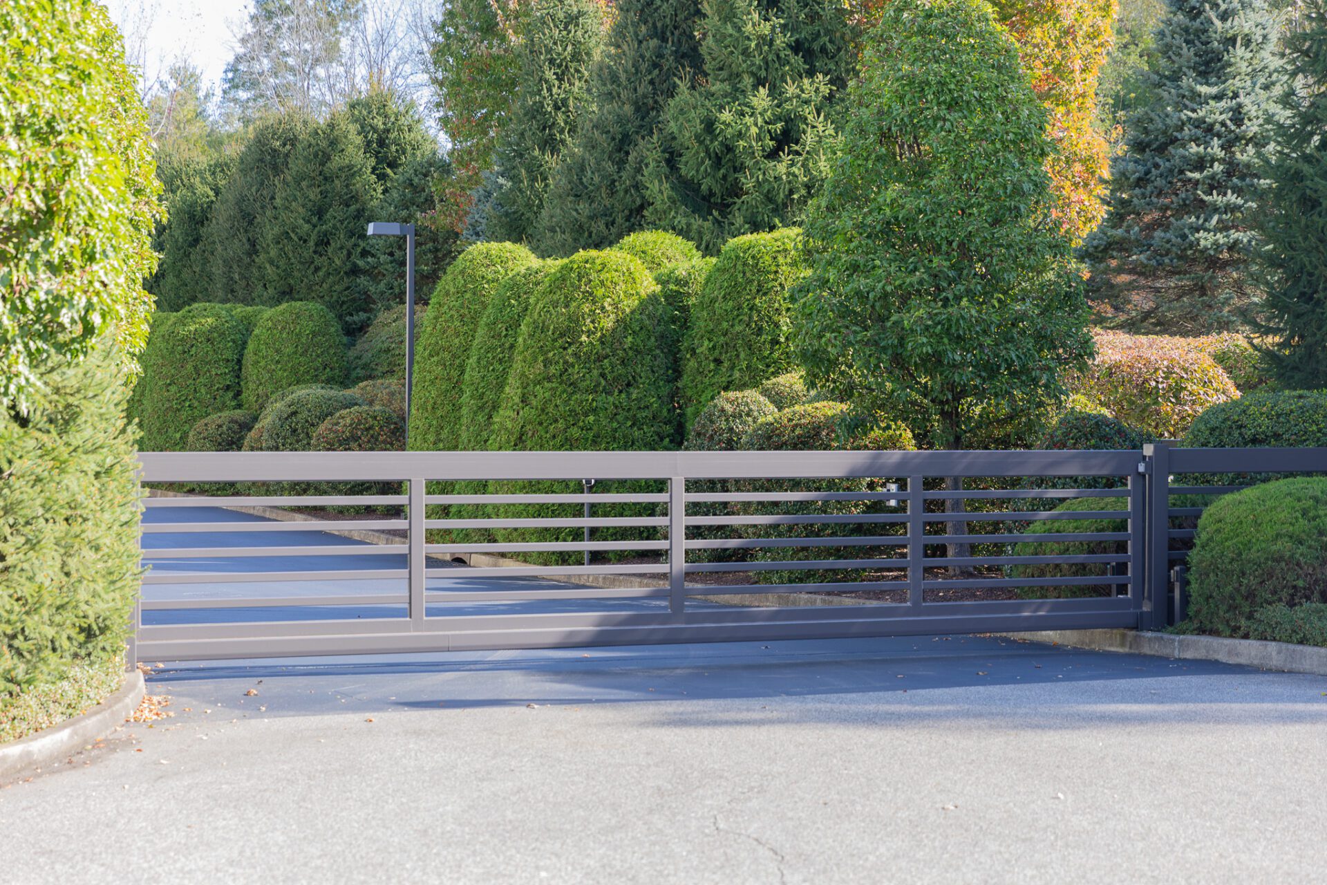 modern gray sliding driveway gate