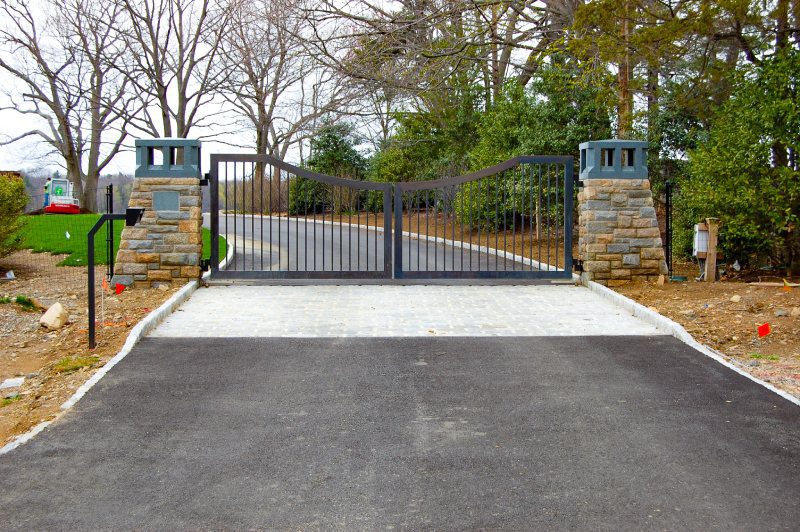 Two Stonework Columns and Modern Metal Gate.