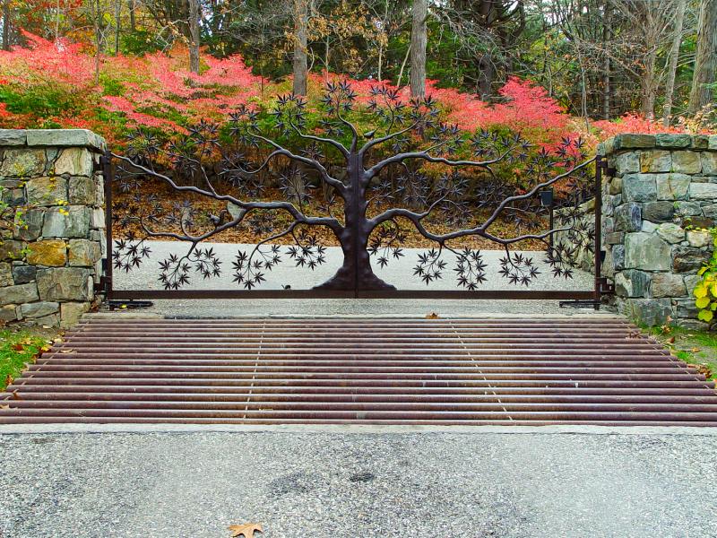 Metalwork Gate Designed To Resemble a Tree with Flowering Branches.