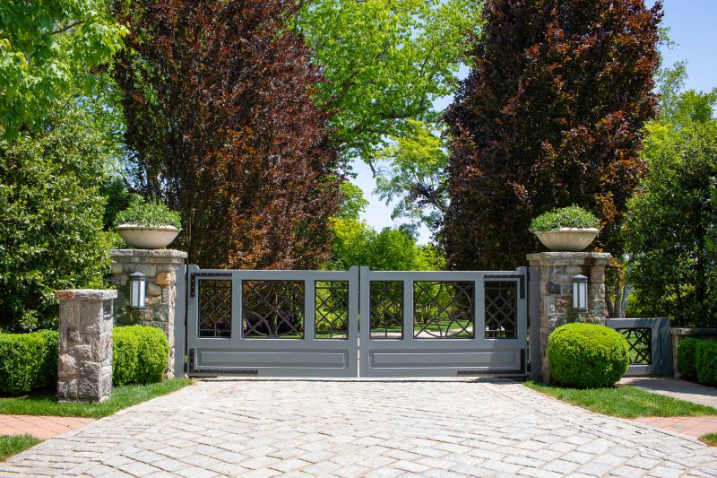 Two Large Greek Style Planters and Stone Columns.