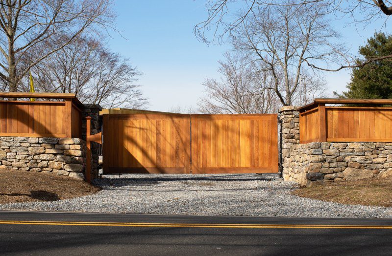 Vertically Patterned Warm Colored Wood Contrasts With Cool Toned Horizontal Stonework.