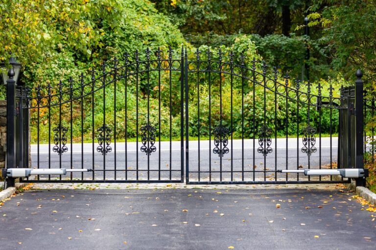 metal driveway gate with traditional fleur de lis design