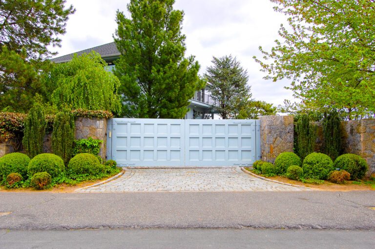 white modern gate with square design and subtle stone columns