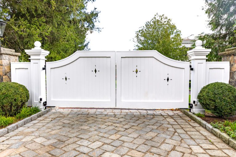 composite white driveway gate with diamond cut outs