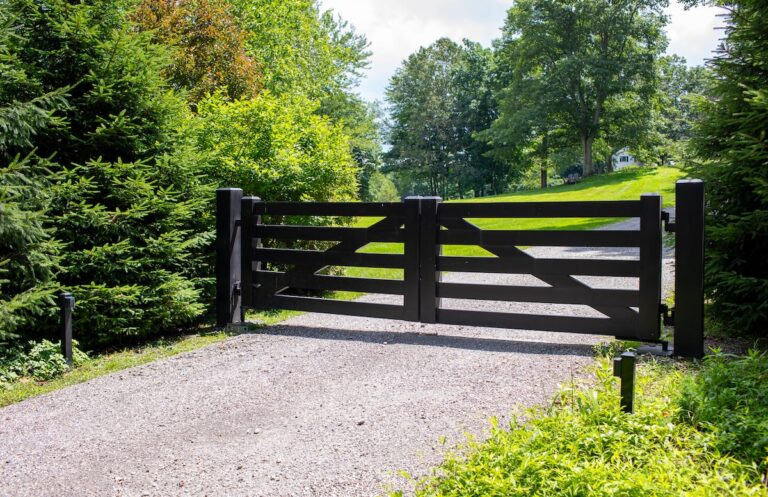 sleek black modern post rail inspired swing driveway gate