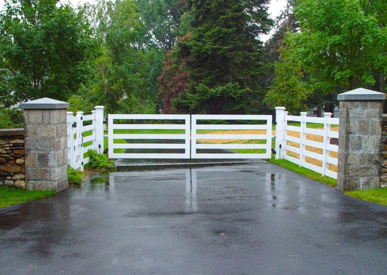 farmhouse wooden driveway gate with simple post rail design and fence