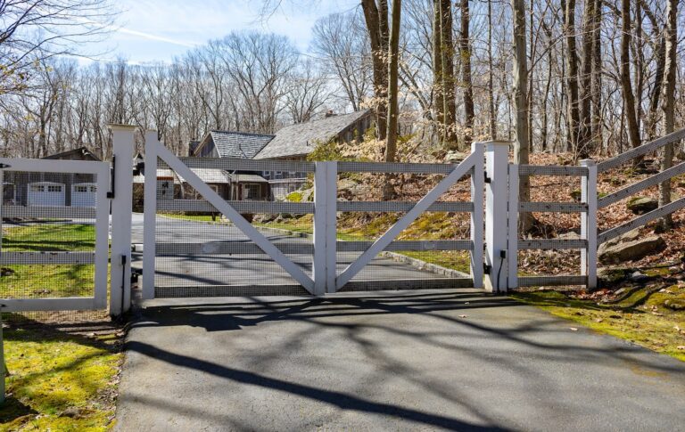 white post rail wooden driveway gate with mesh
