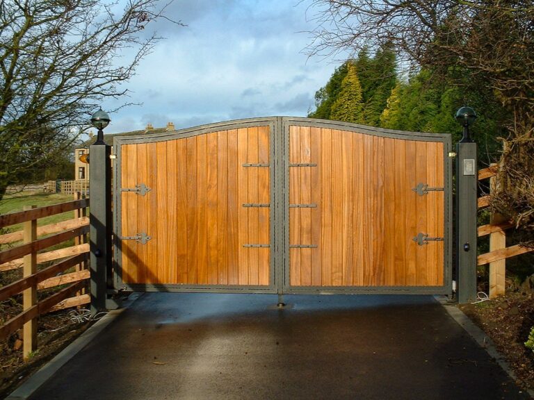 large wood driveway gate with secure steel frame